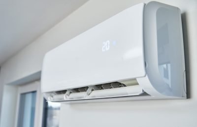 Adjusting temperature on air conditioner, Working air conditioner for comfort temperature in home at hot summer, cooling air in the room